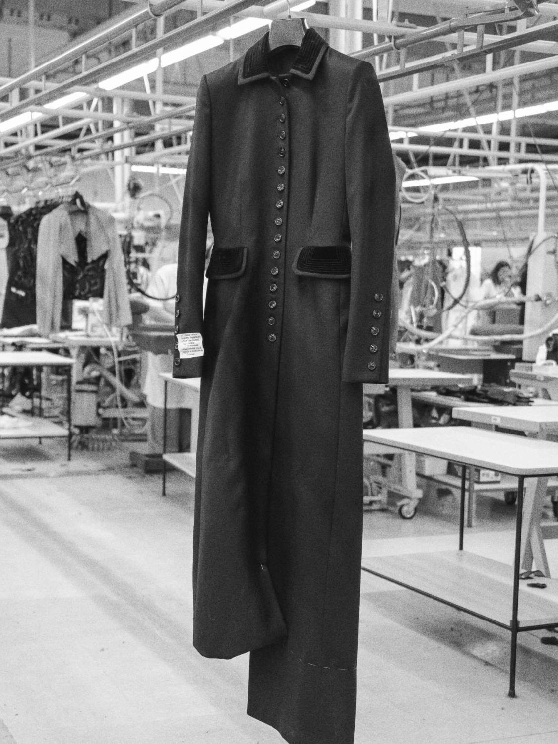 A finished coat hanging on the factory floor
